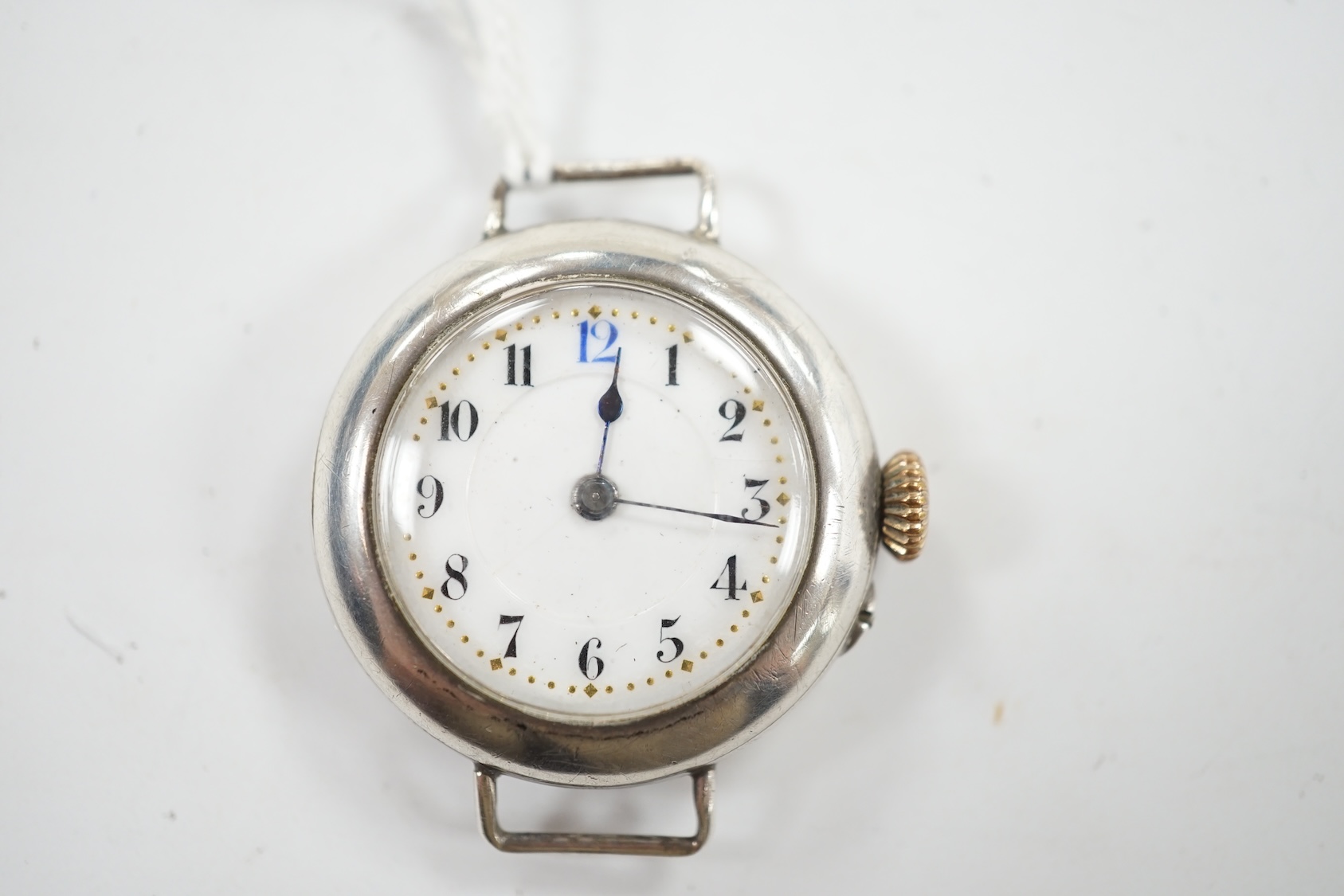 A George V silver manual wind wrist watch, with Arabic dial, no strap. Condition - poor